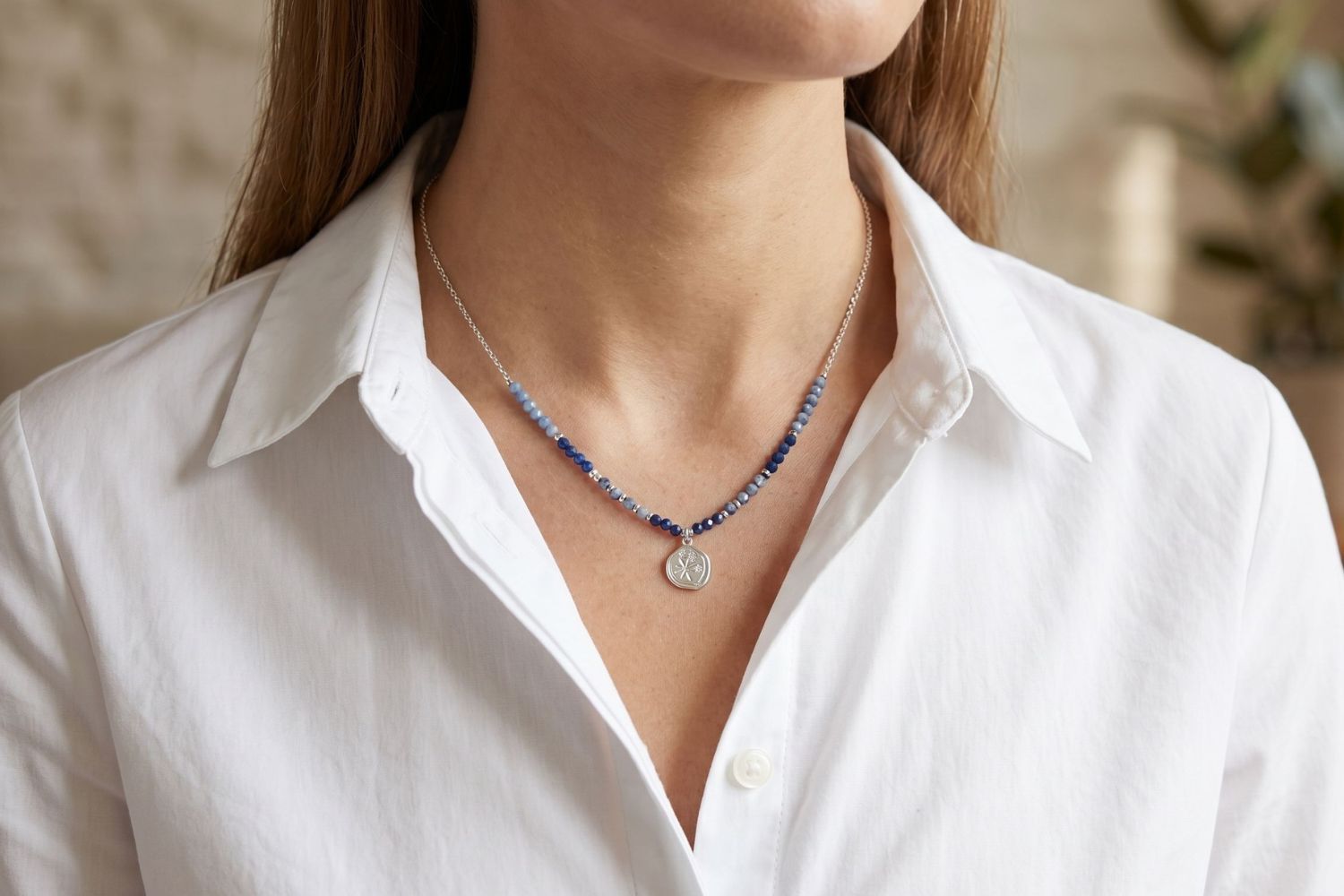 Allat Silver Sodalite Beaded Pendant Necklace styled on model, showcasing deep blue sodalite beads and a silver star-engraved pendant with a celestial, boho finish.
