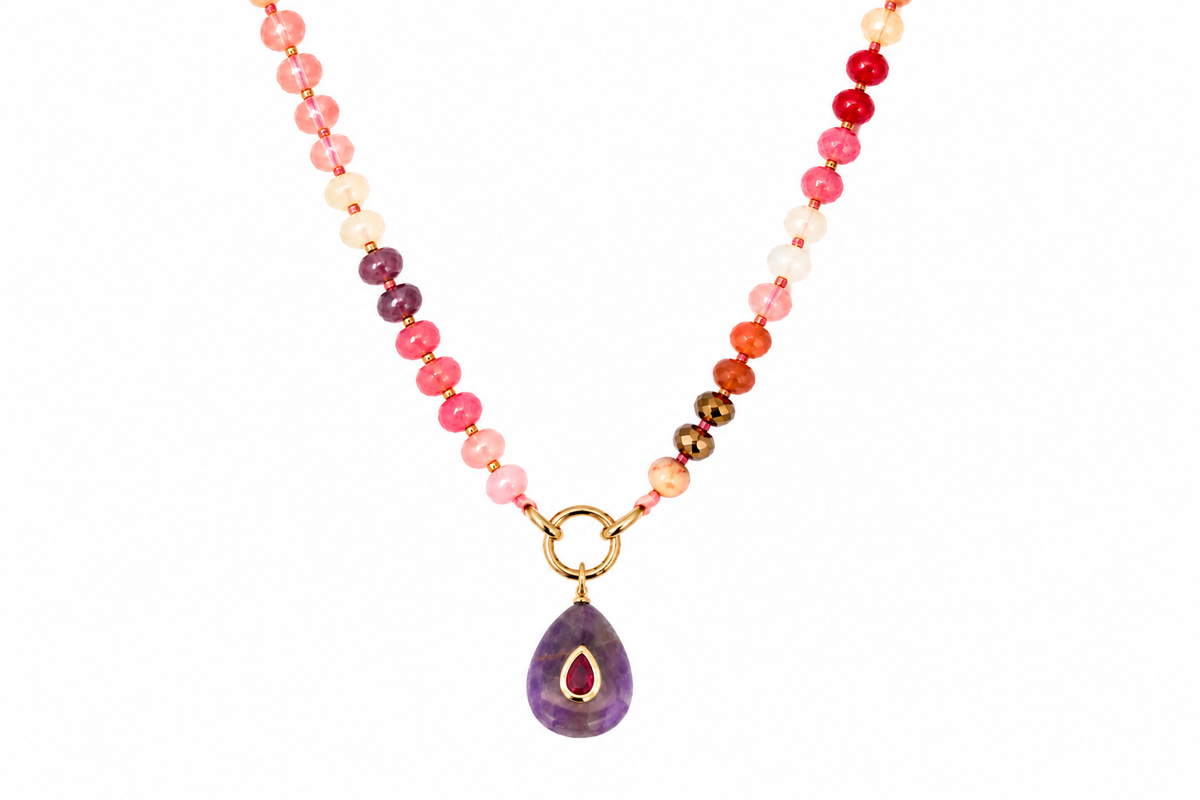 Amala Red Mix gold charm carrier necklace finished with a Fleur amethyst teardrop pendant, a waterproof Boho Betty gemstone necklace.