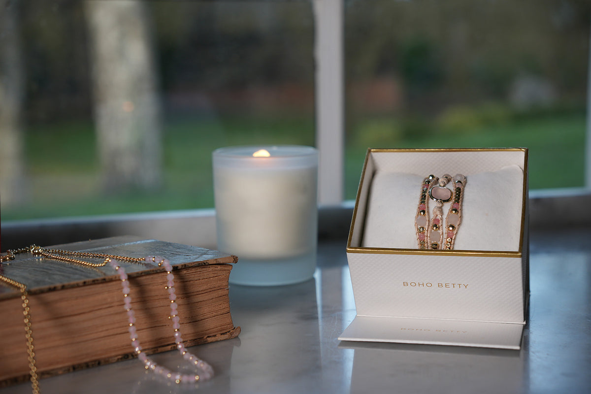 America Rose Quartz & Pink Tourmaline Gold Wrap Bracelet in a white and gold Boho Betty gift box, soft pink stones and gold beads woven on blush cord