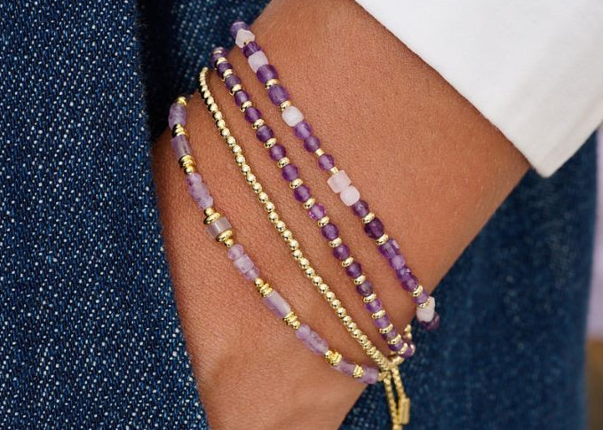 Annabelle Kunzite & Amethyst Wrap Bracelet styled in a stacked look with golden tones and soft fabrics for an elegant boho finish.