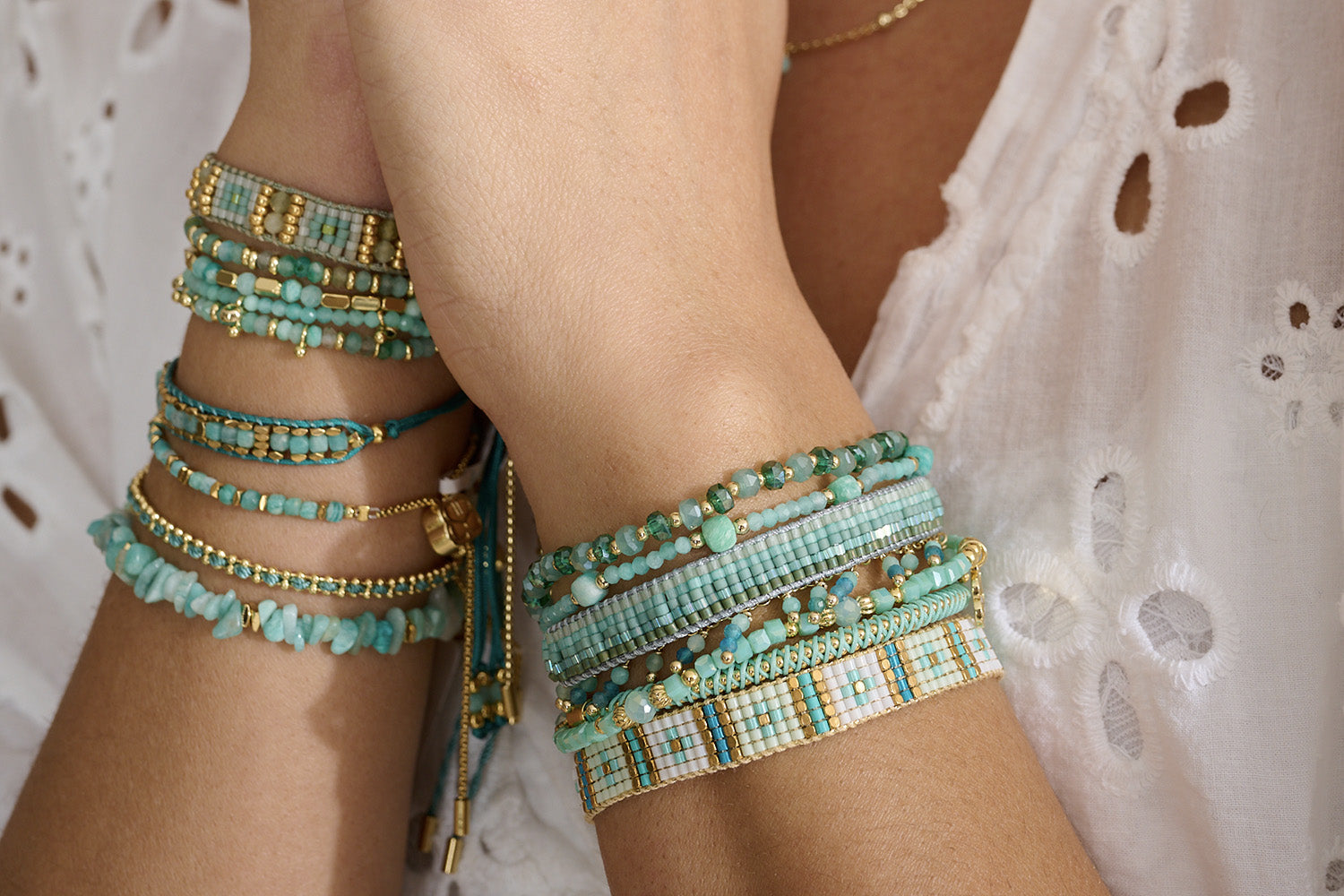 Aurora Aqua Gold Friendship Bracelet styled on the wrist, showcasing dreamy aqua hues and shimmering gold details, perfect for layering or wearing solo.