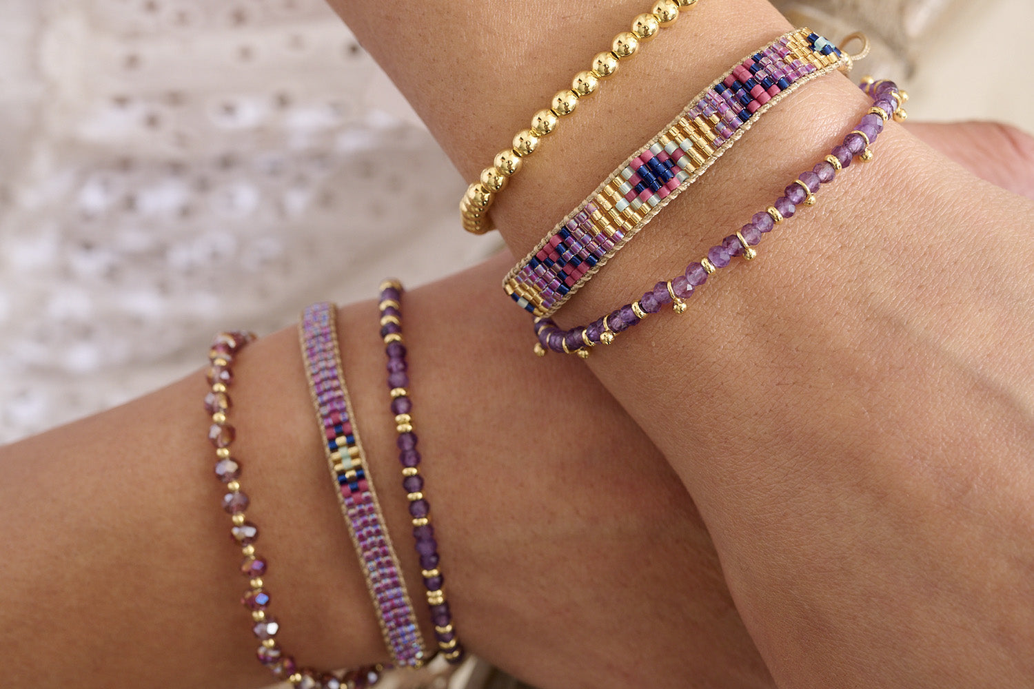Bali Amethyst & Gold Bracelet Stack styled with vibrant purple tones and golden accents, perfect for gifting or glowing up your everyday look.