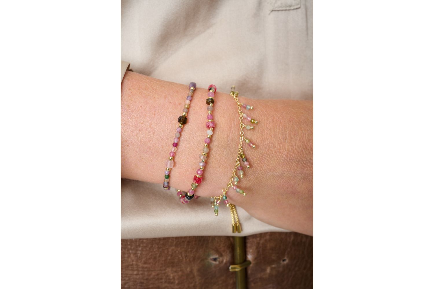 Beryl Gold & Tourmaline Gemstone Bracelet styled on the wrist, showing multicoloured tourmaline beads and gold details in a joyful, boho-inspired look.