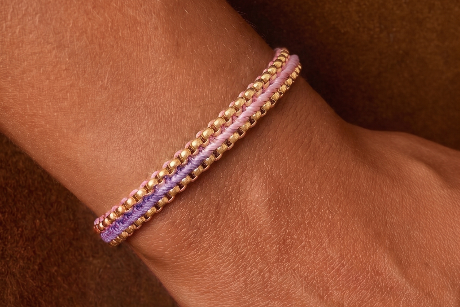 Bloom blush lilac gold braided bracelet featured on wrist with Boho Betty stacking bracelets