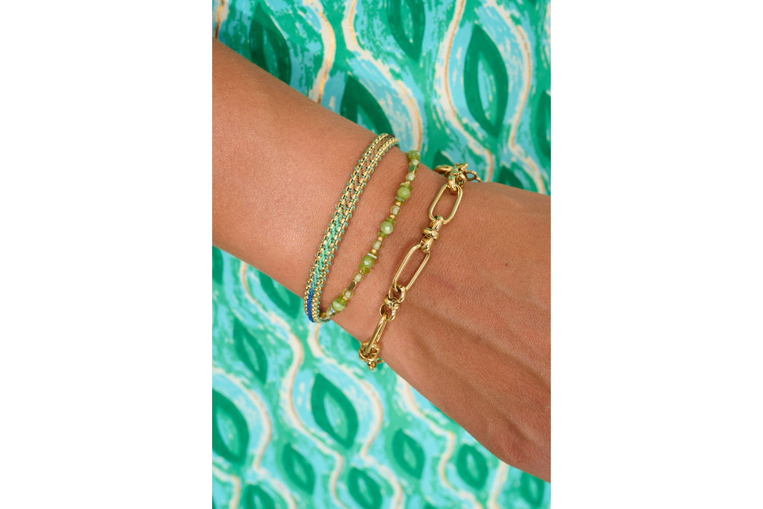 Bloom Gold, Taupe & Green Braided Bracelet styled on the wrist, featuring woven ombre thread and gold accents, ideal for summer layering or gifting.