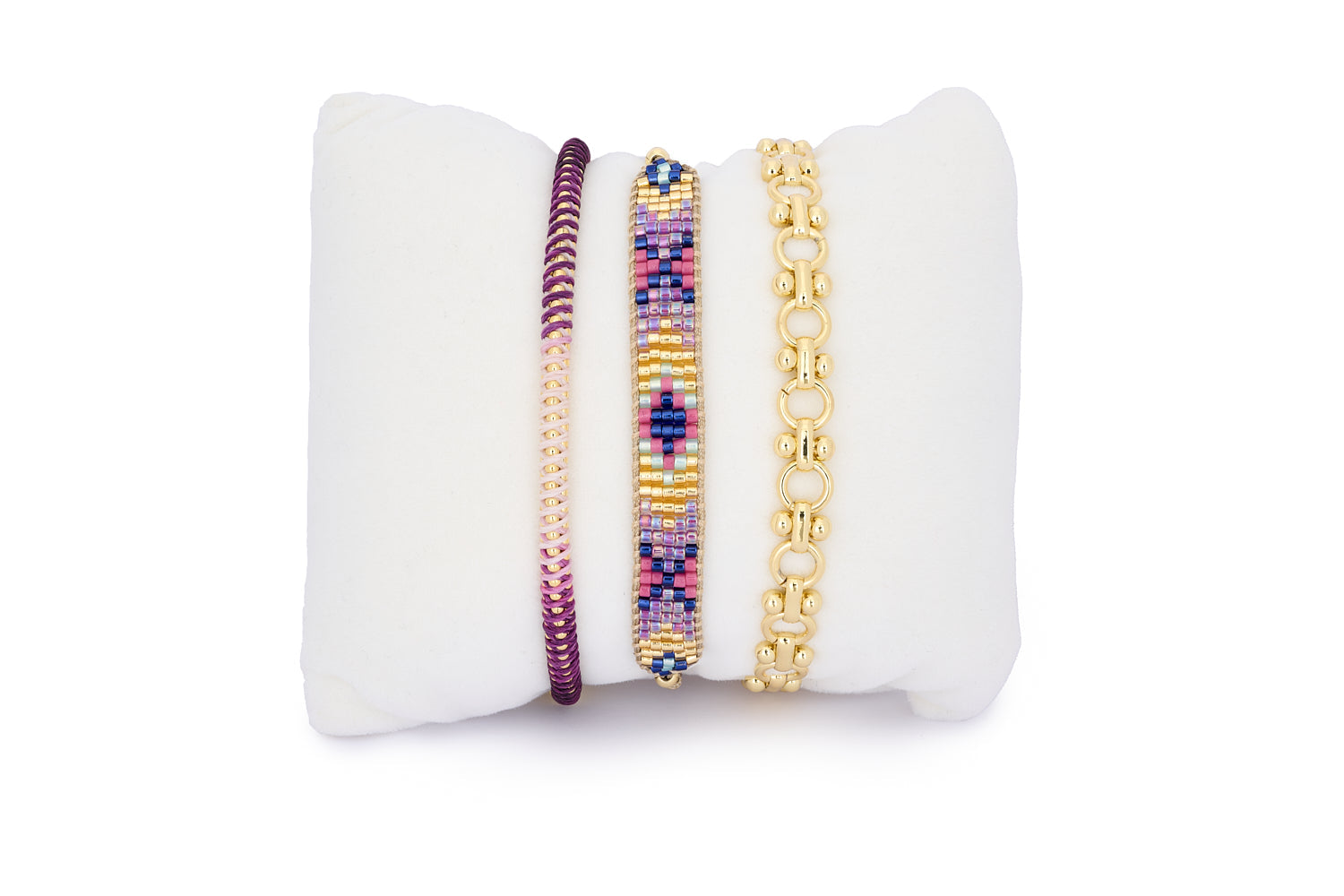 Bora Bora Purple & Gold Stacking Bracelet featuring three layered bracelets in lilac, pink, and gold tones with beadwork, braids, and bold links—perfect for vibrant boho styling.