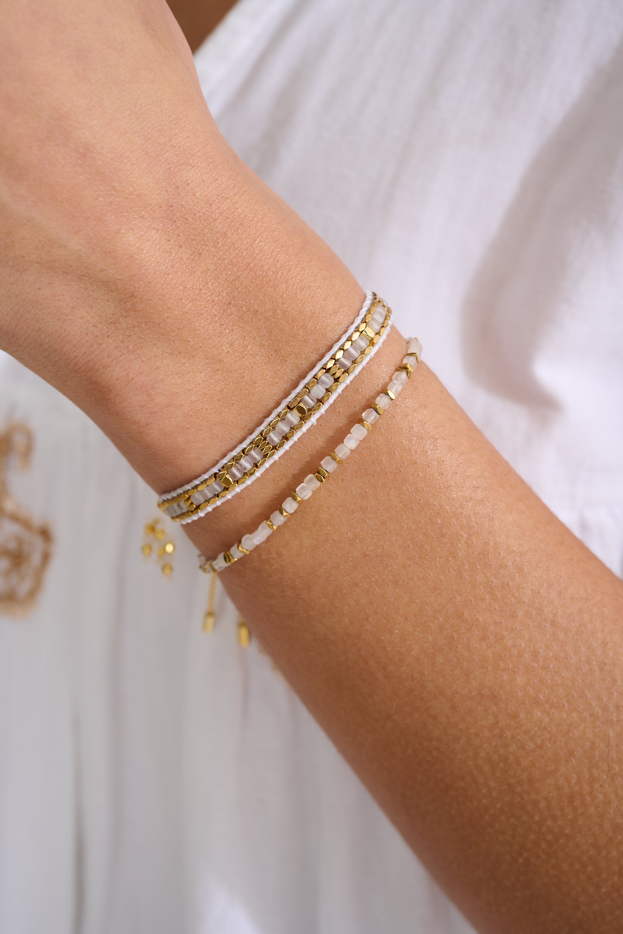 Celeste Rainbow Moonstone & Gold Stack styled with soft tones and glowing light, perfect for celebrating new beginnings or thoughtful gifting.