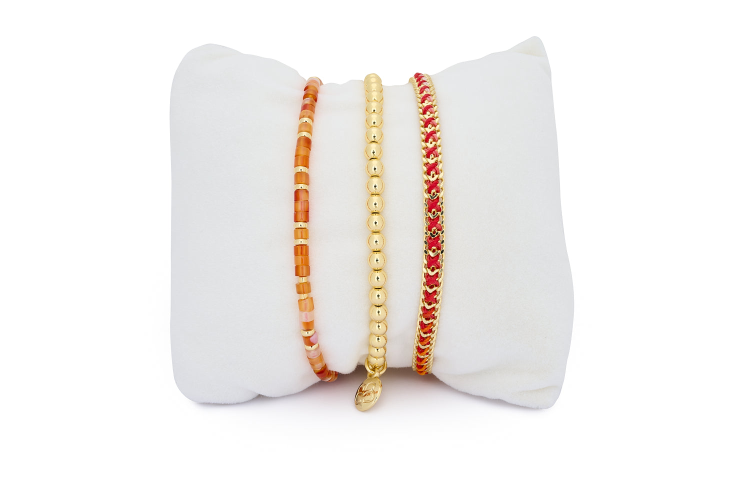 Cocos Gold & Red Agate Bracelet Stack featuring red gemstone beads, gold stretch bracelet, and sunset-toned woven strand for a radiant, fiery wrist stack.