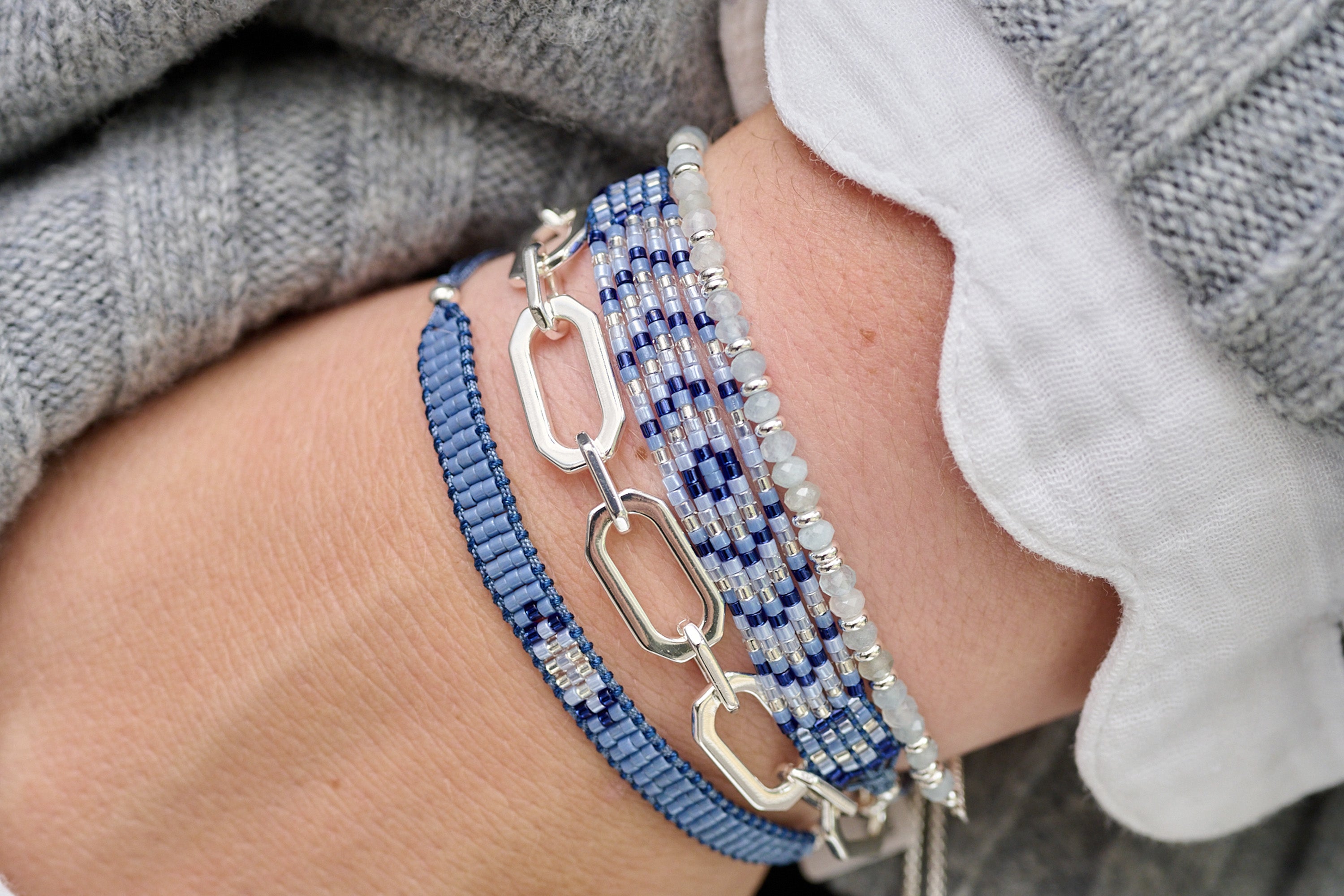 Crisos Silver Chunky Chain Bracelet styled with a sophisticated outfit, showcasing its bold geometric links and polished silver finish for a modern, striking look.
