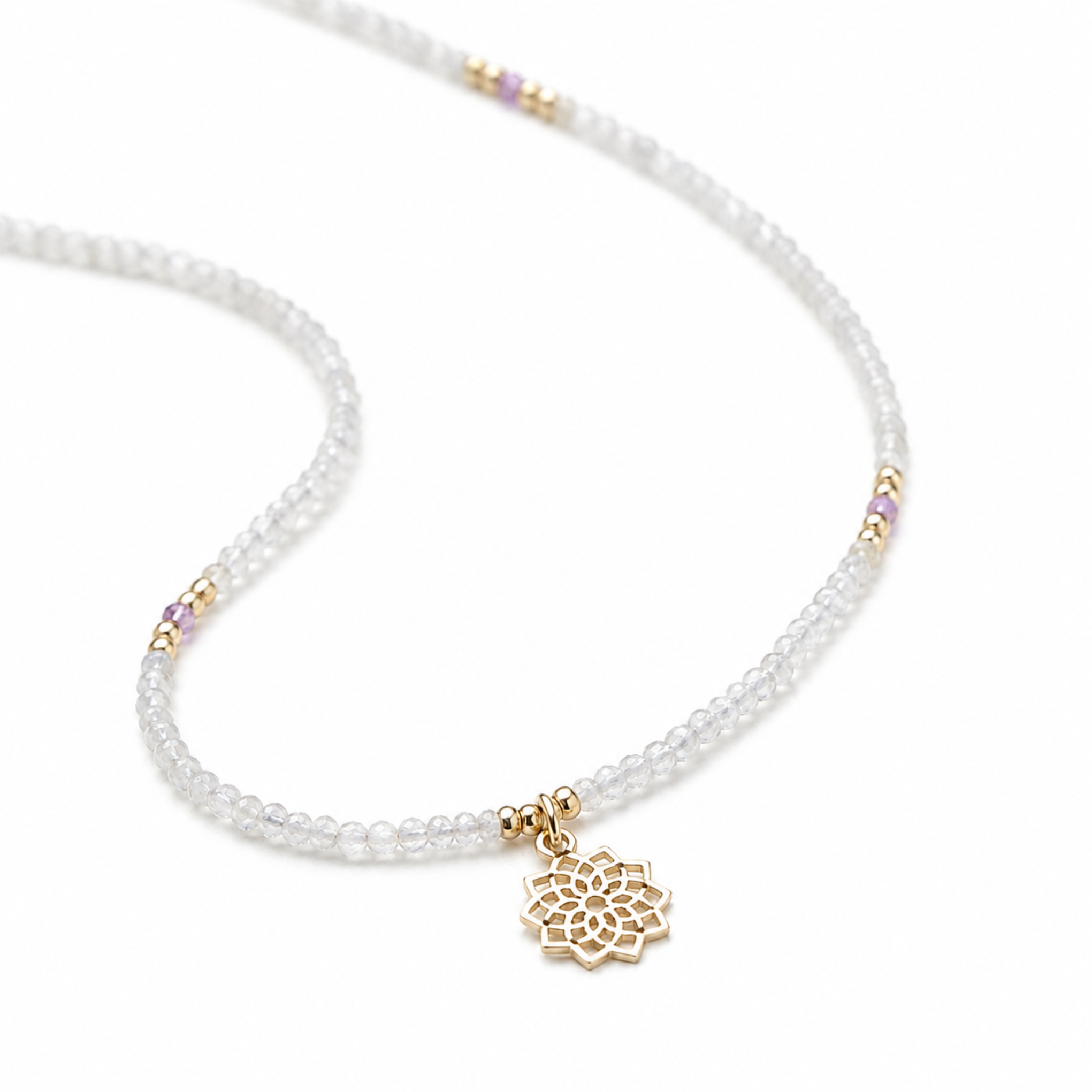 A delicate beaded necklace featuring small labradorite beads, gold spacer accents, and a gold crown chakra pendant, displayed on a clean white background.
