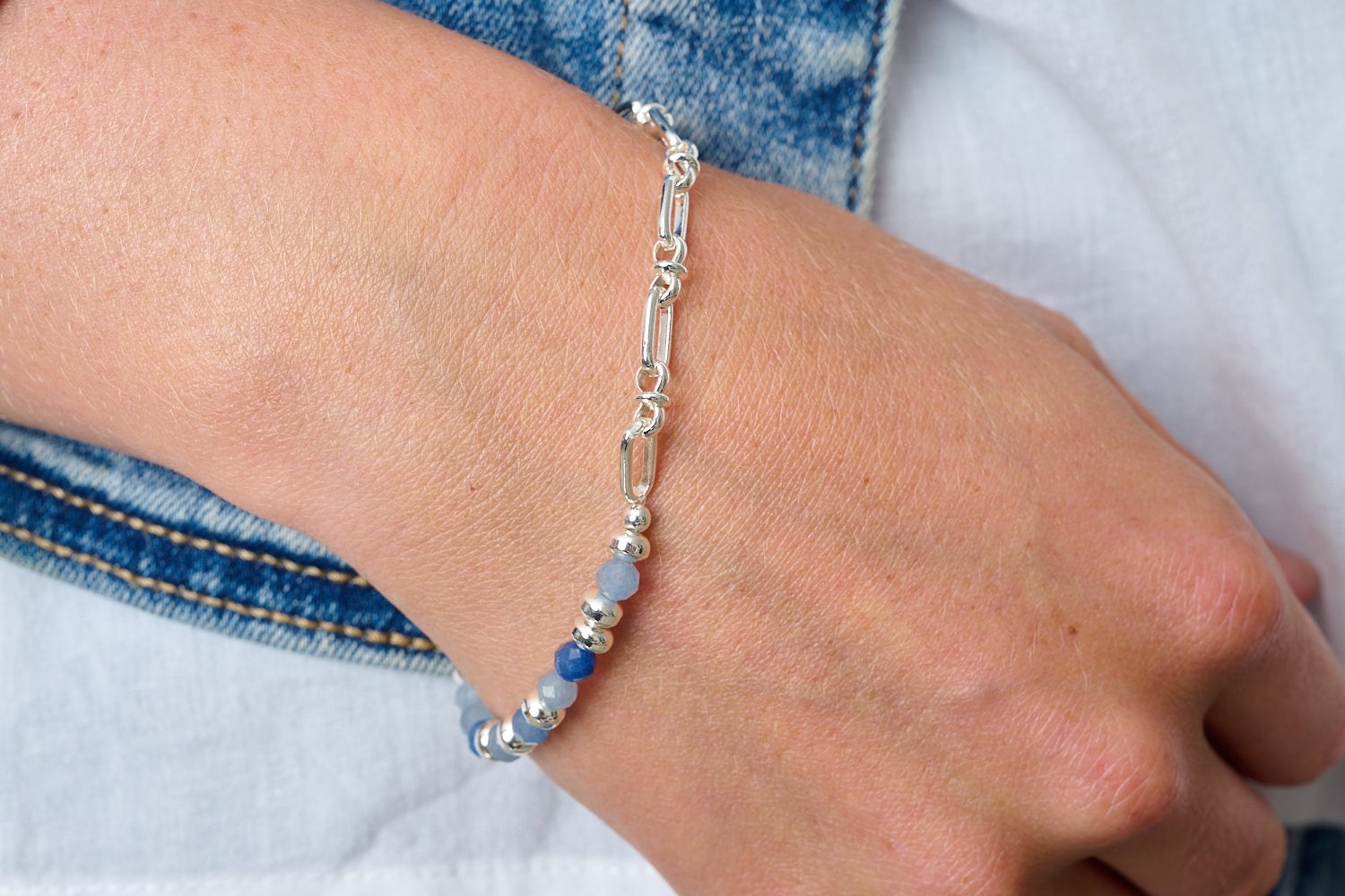 Dahlia Blue Aventurine & Silver Beaded Bracelet featured on wrist with Boho Betty stacking bracelets in silver and blue gemstone tones.