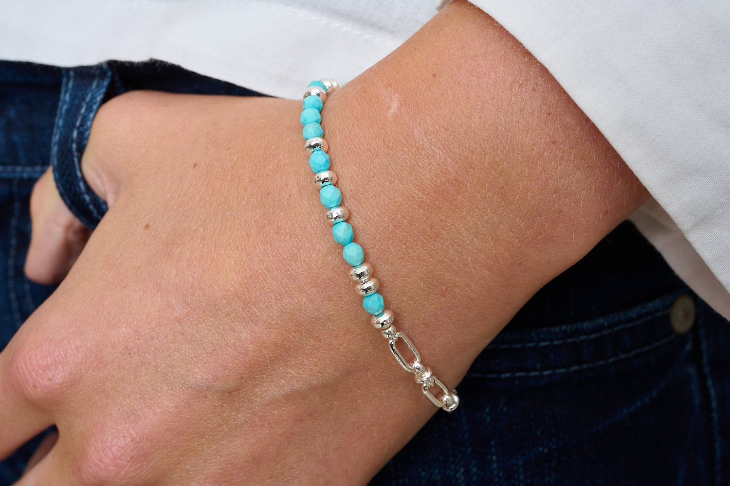 Dahlia Turquoise Howlite & Silver Beaded Bracelet featured on wrist with Boho Betty stacking bracelets in turquoise and silver tones.