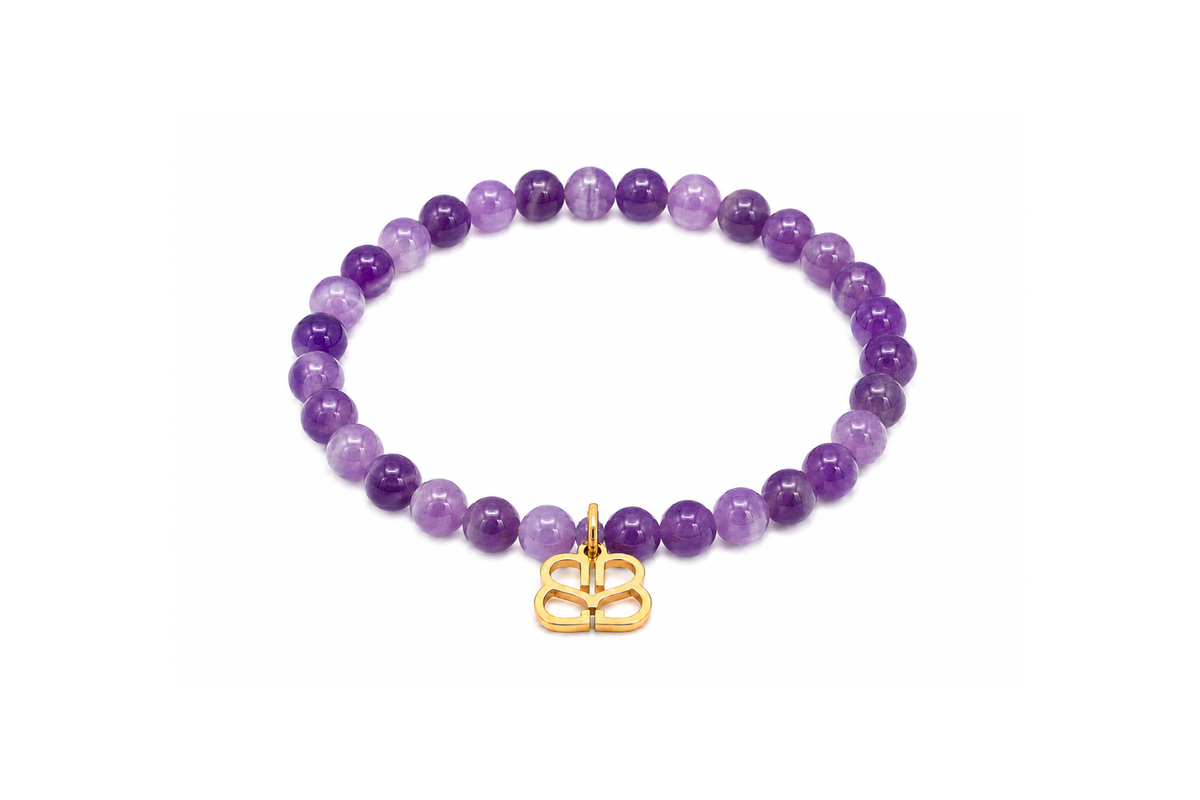 Mani Gold Amethyst Bead Bracelet featuring smooth Amethyst gemstone beads, a signature Boho Betty filigree charm and waterproof 14k Gold PVD stainless steel details.