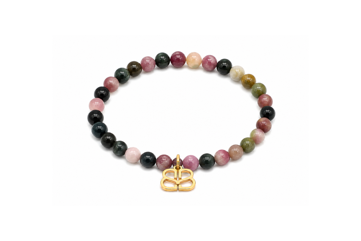 Mani Gold Tourmaline Bead Bracelet featuring smooth Tourmaline gemstone beads, a signature Boho Betty filigree charm and waterproof 14k Gold PVD stainless steel details.
