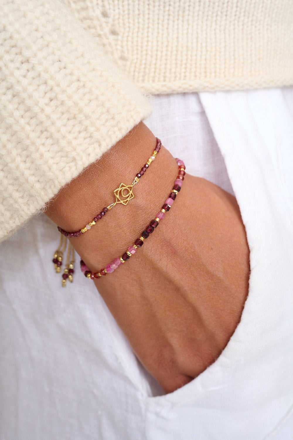 Garnet bracelet worn on wrist, styled with Boho Betty stacking bracelets.