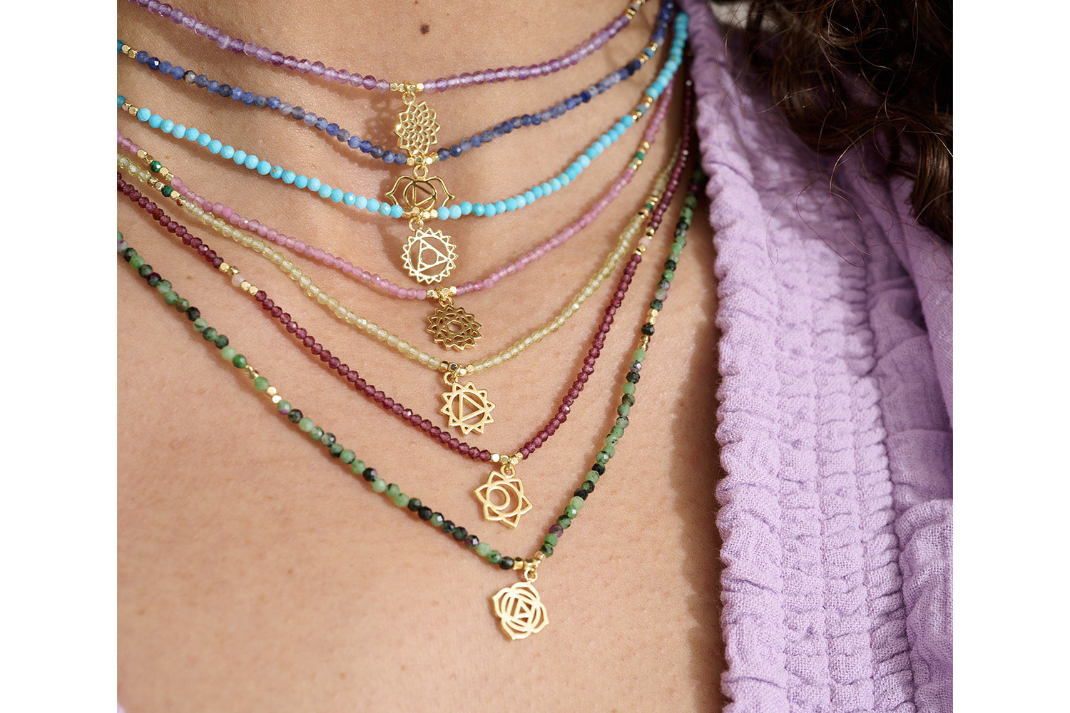 Garnet and Sunstone Gold Sacral Chakra Necklace styled effortlessly, showcasing vibrant garnet, radiant sunstone, and gold details for a bold, creative, and empowering look.