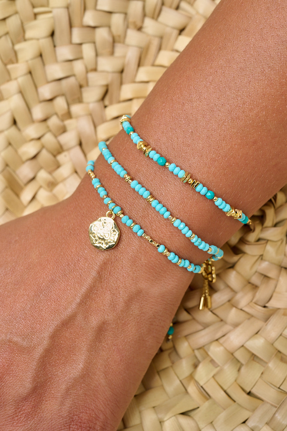 Iris gold turquoise howlite bracelet featured on wrist with Boho Betty stacking bracelets