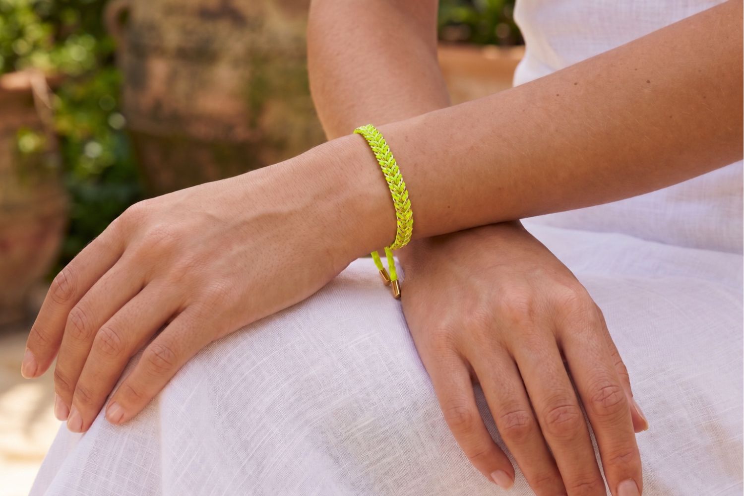 Iztac Gold & Neon Yellow Woven Bracelet styled on the wrist with neon yellow woven detailing and warm gold accents for bold boho stacking.