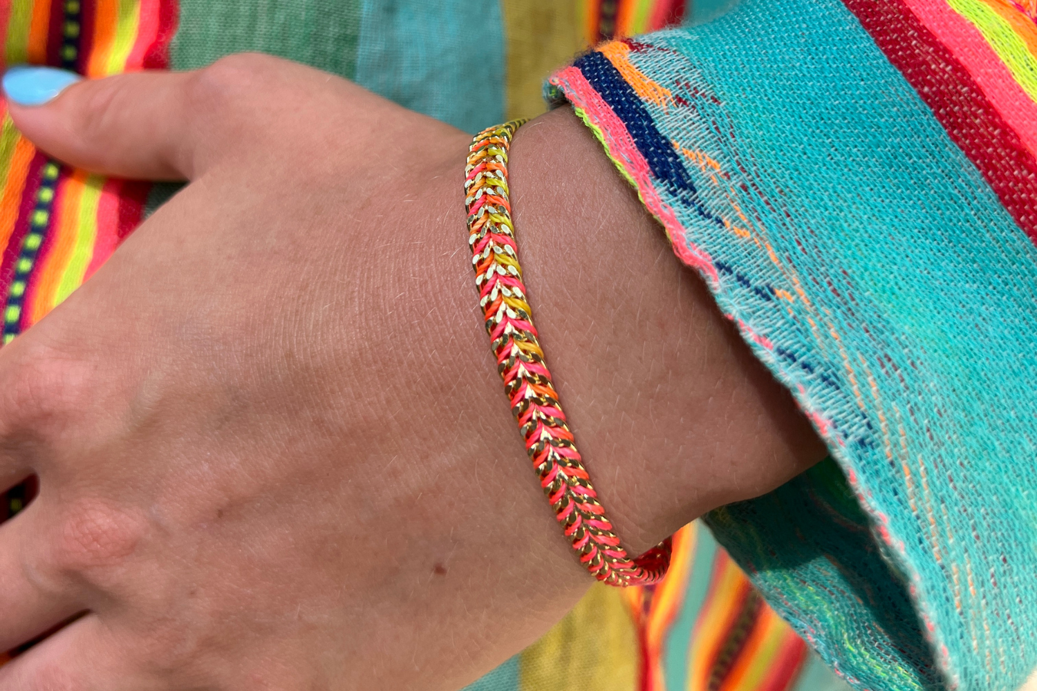 Iztac Havana Brights Gold Braided Bracelet styled on the wrist, showcasing colourful woven threads and warm gold PVD details for effortless boho layering.