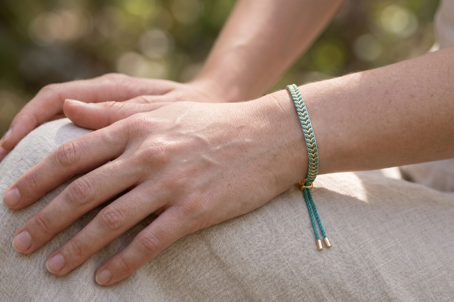 Iztac Teal Gold Woven Bracelet styled on the wrist, showcasing colourful teal woven detailing and warm gold accents for relaxed boho styling.