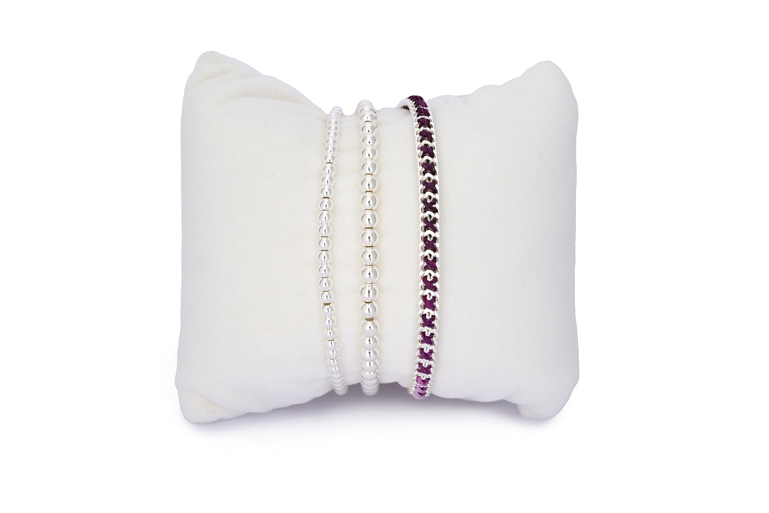 Jeju Purple & Silver Bracelet Stack featuring a woven ombré purple bracelet and two polished silver stretch beaded bracelets in a layered set.