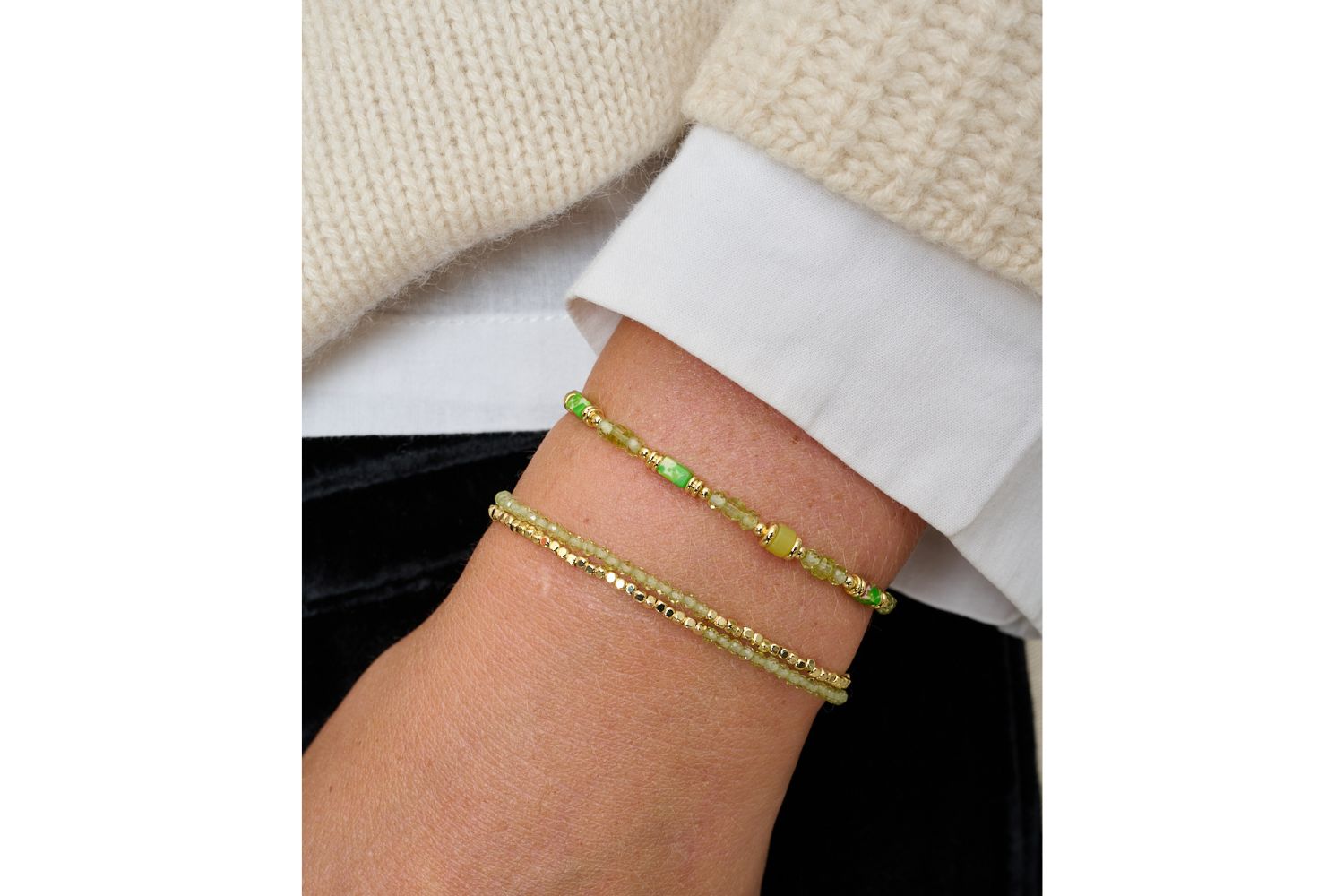 Juniper Peridot & Gold Multi-Strand Bracelet featured on wrist with Boho Betty stacking bracelets in gold and green gemstone tones.