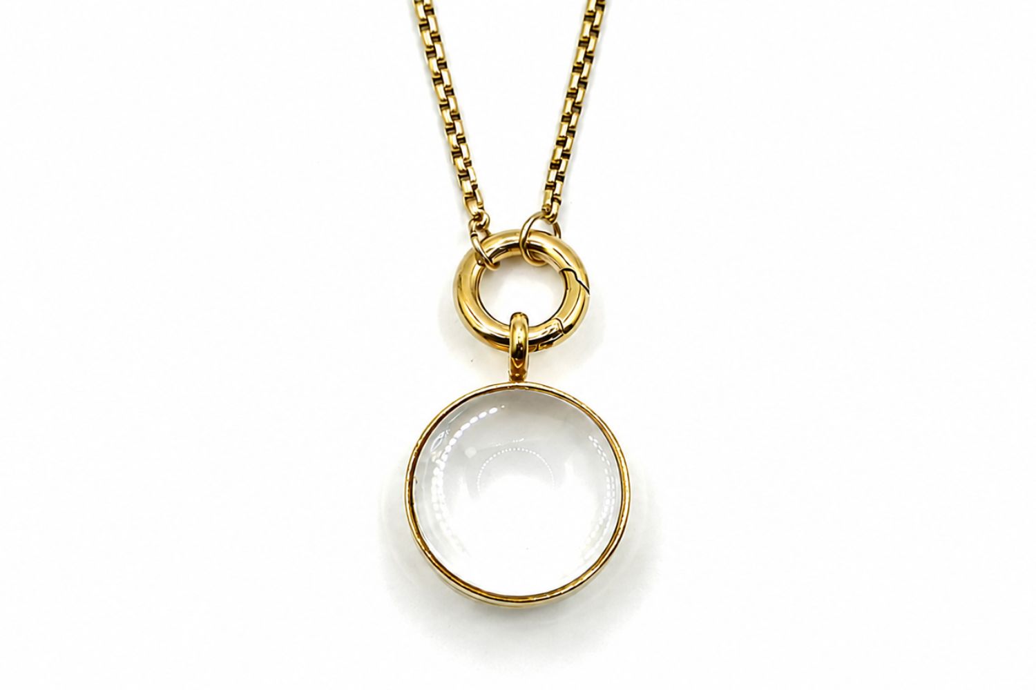 Leilani midi gold locket necklace with glass front designed to hold gemstone chips and letter charms on a gold chain.