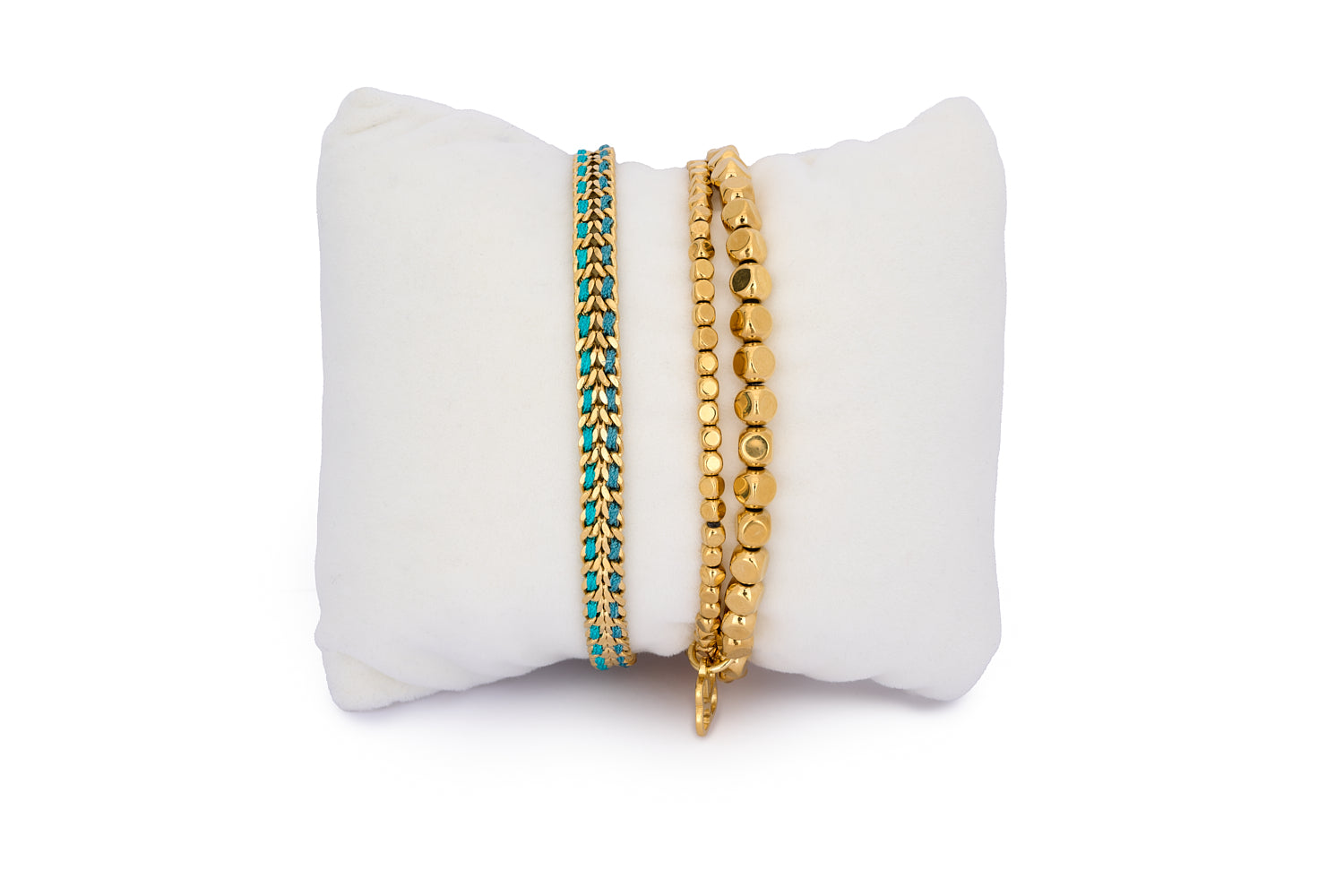 Lifou Teal & Gold Bracelet Stack featuring a bold stretch gold bracelet and a turquoise braided chain design for an ocean-inspired boho look.