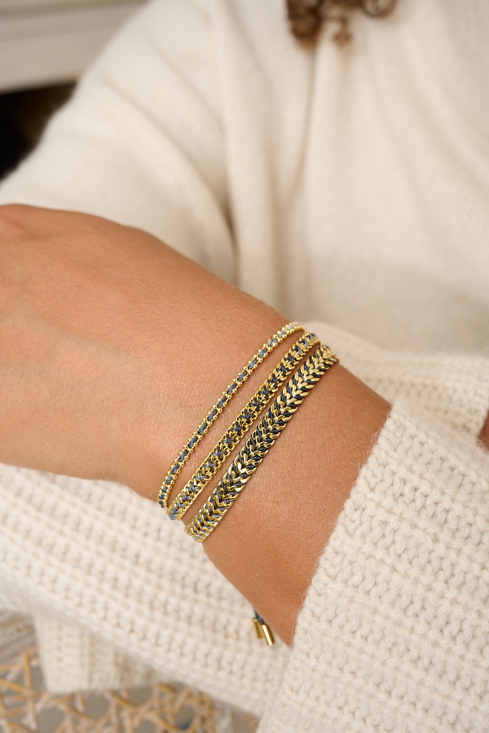 Lilia charcoal and gold bracelet featured on wrist with Boho Betty stacking bracelets