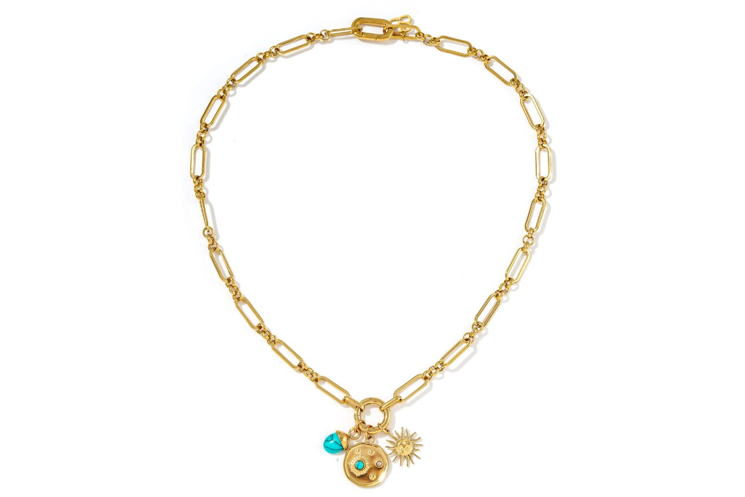 Full length Luma Turquoise Howlite Gold Necklace with detachable charms in gold and turquoise.