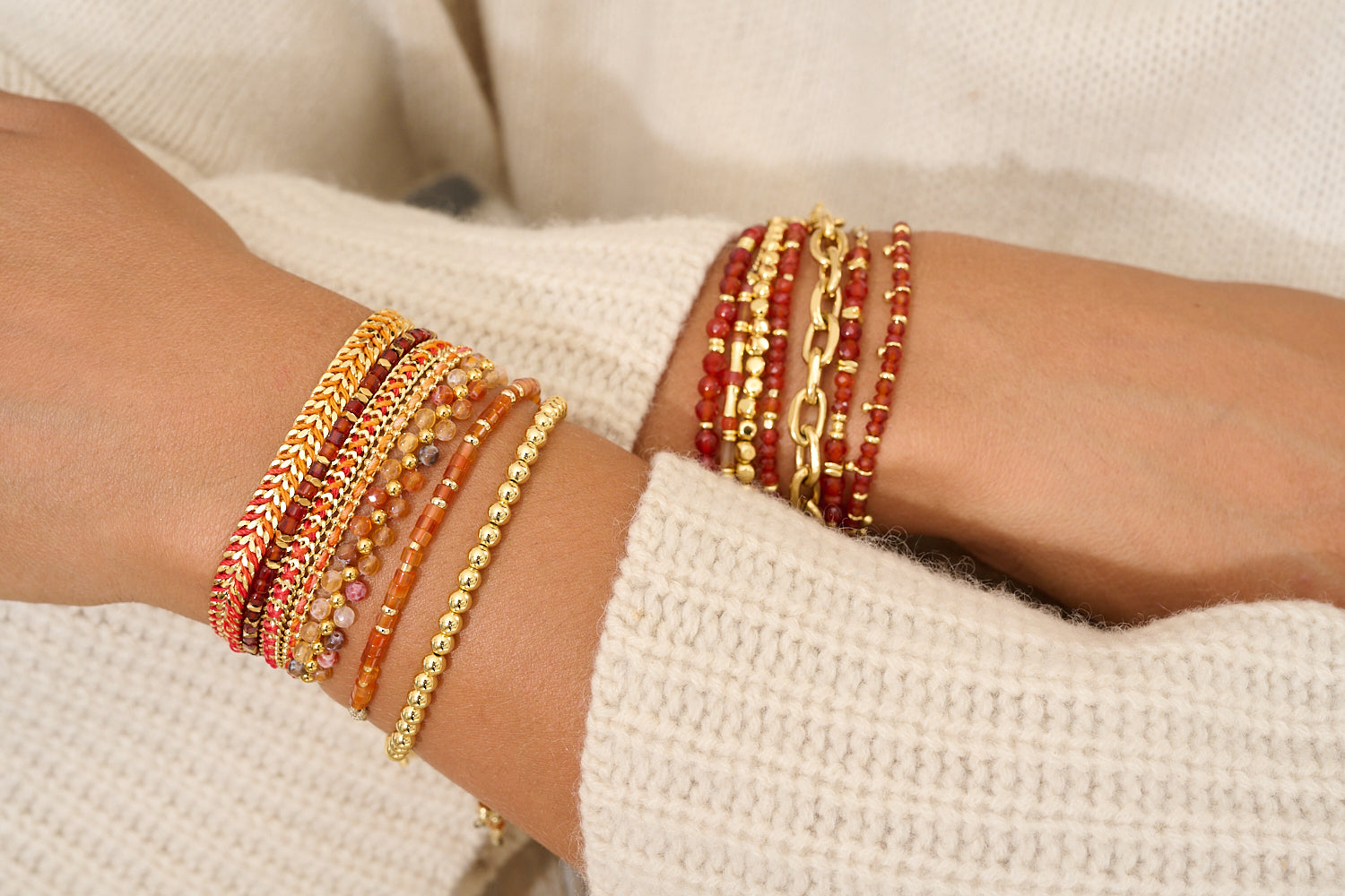 Marisol Gold & Orange Agate Gemstone Bracelet styled on a wrist, showcasing its vibrant orange agate, gold details, and confident, carefree boho energy, perfect for any social occasion.