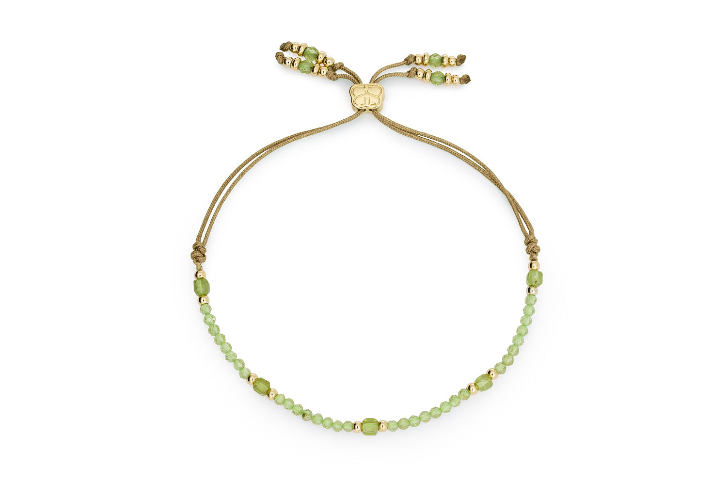 Meadow Gold & Peridot Slider Bracelet featuring faceted green gemstones, gold-plated accents, and an adjustable green cord with beaded ends.