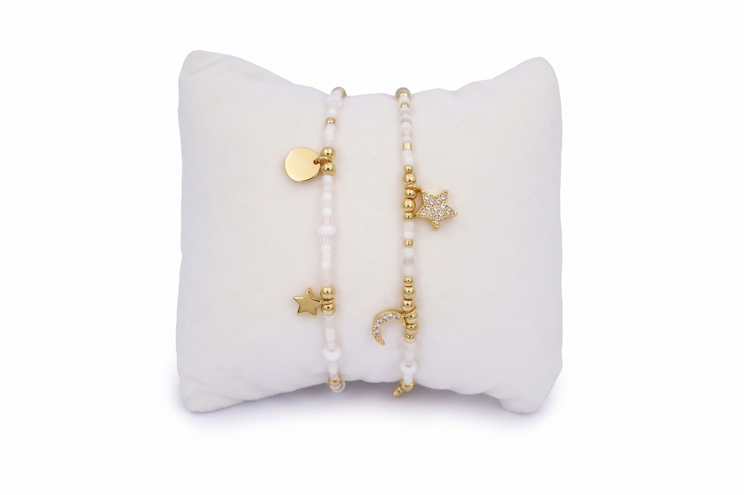 Mondesi White & Gold Stacking Bracelets, ivory Miyuki beads with gold moon and star charms in an adjustable duo.