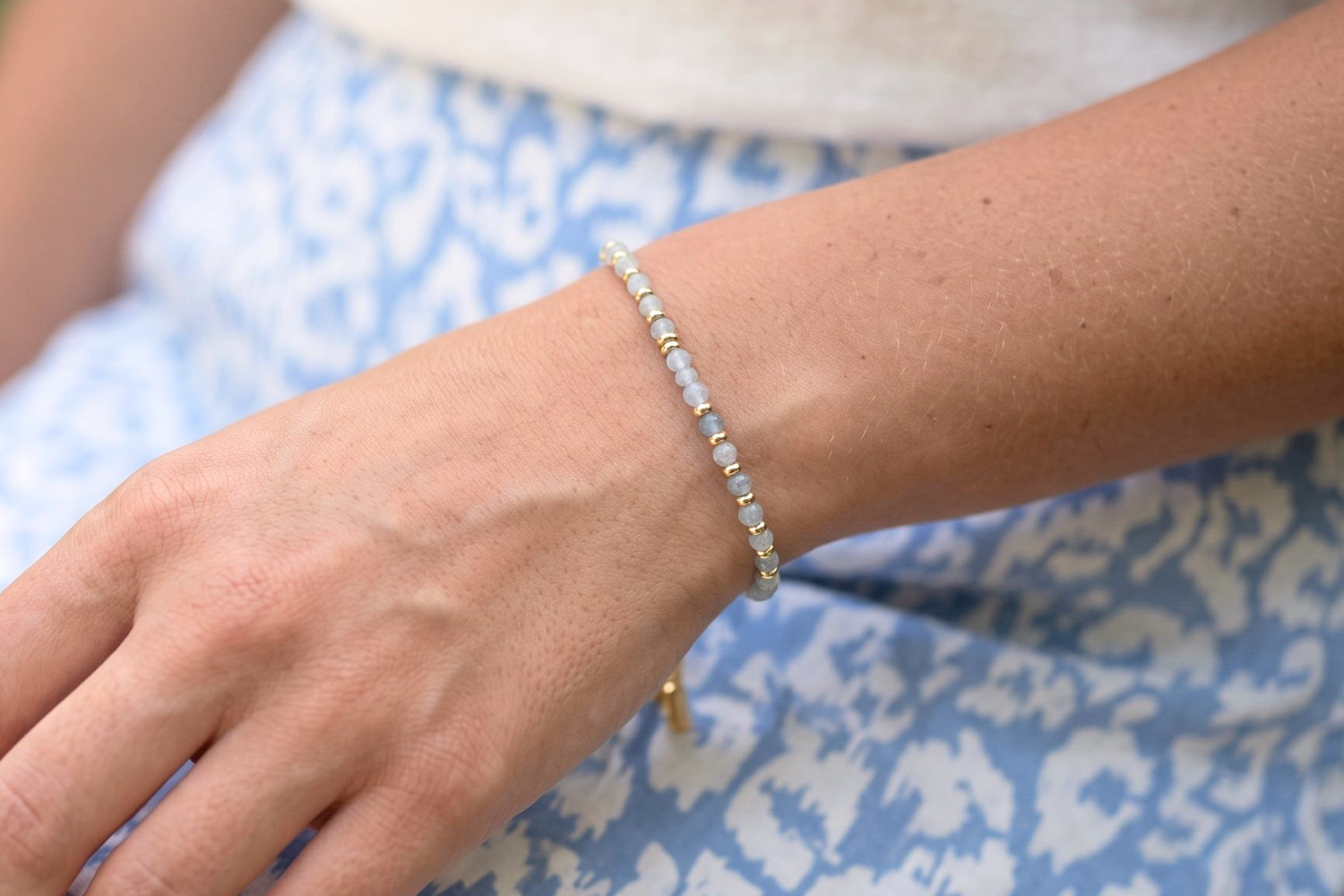 Mystical Aquamarine Gold Bracelet styled on the wrist, showcasing natural aquamarine gemstones and waterproof gold PVD details designed for everyday wear and layering.