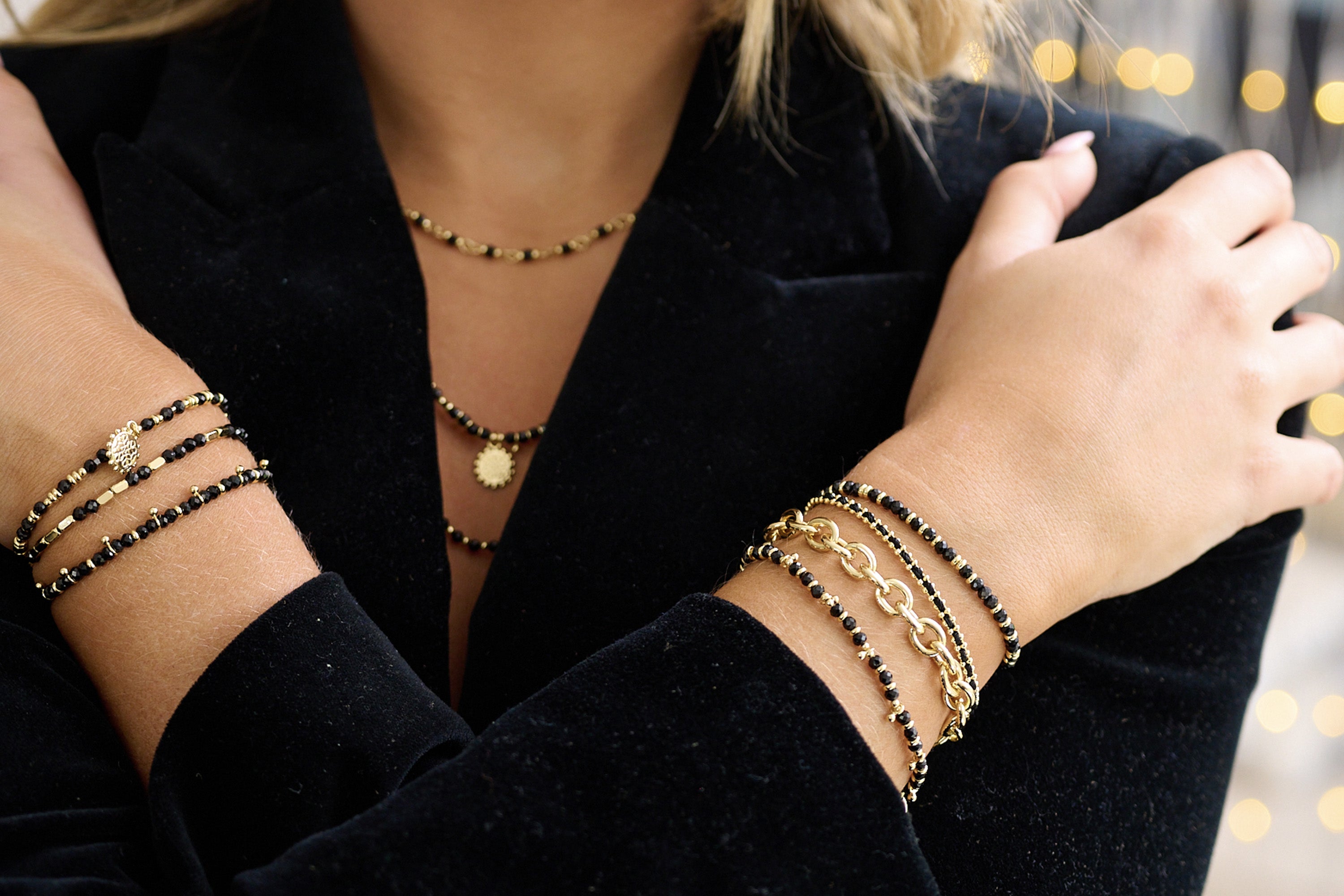 Mystical Black Spinel Bracelet styled with gold jewellery for a bold, confident, and grounded everyday look.