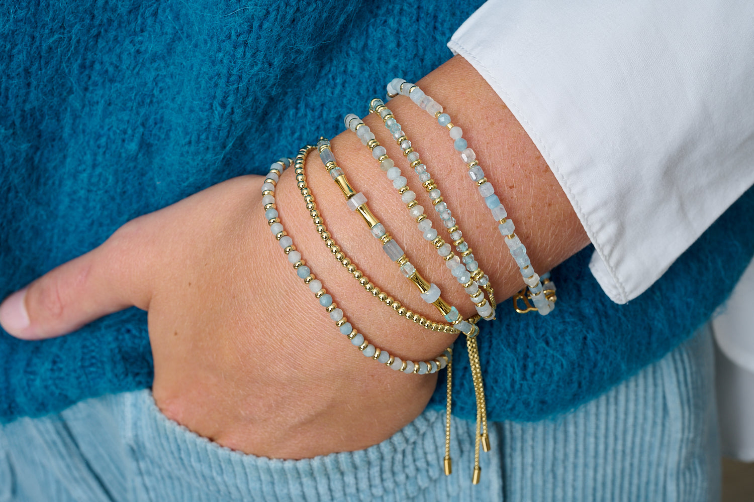 Mystical blue topaz November birthstone bracelet featured on wrist with Boho Betty stacking bracelets