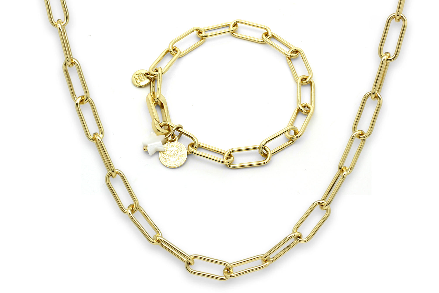 Notus Gold Necklace and Bracelet Set featuring bold geometric links and playful coin and star charms, crafted in radiant 14k gold plating.