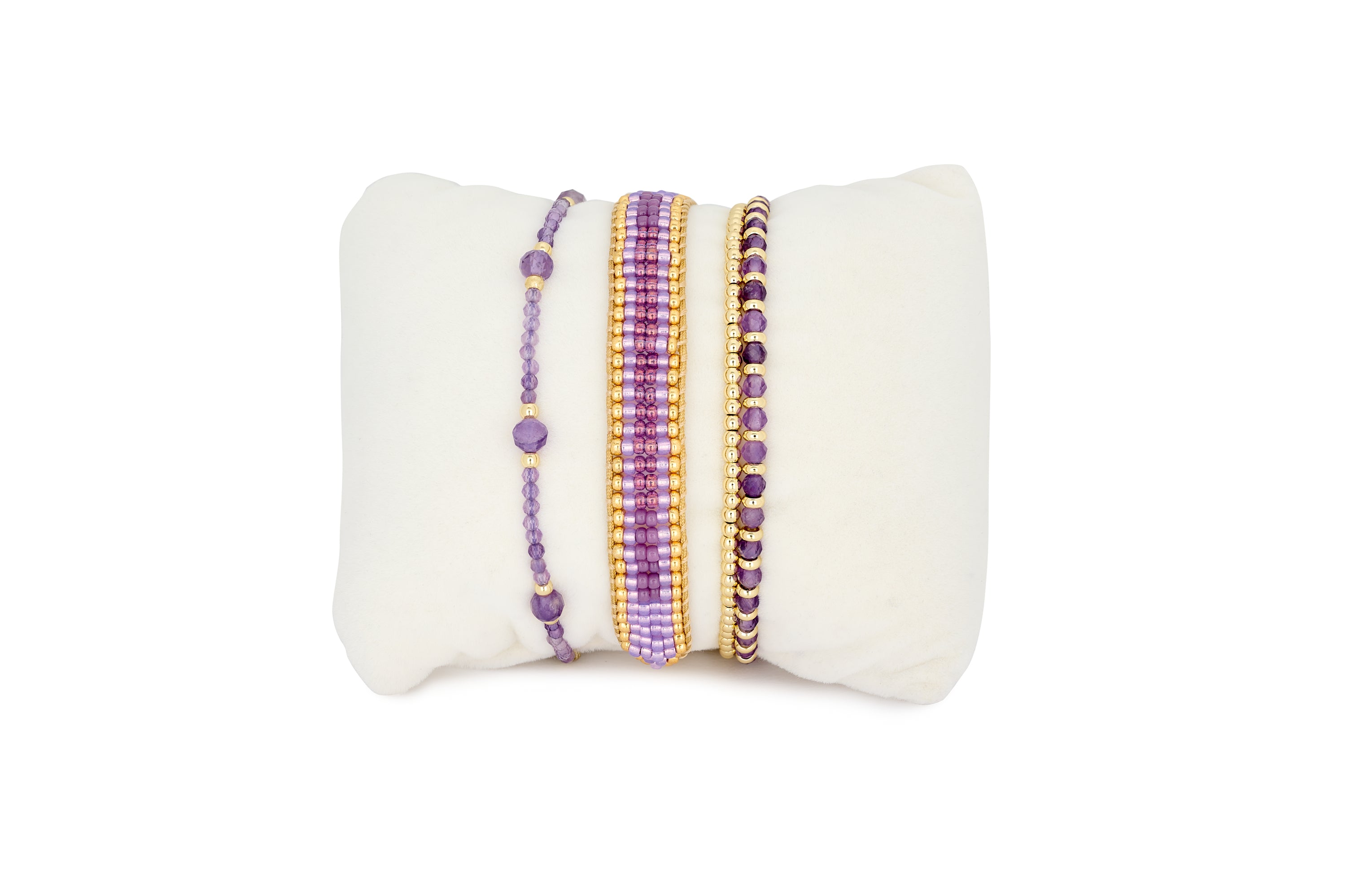 Palmeira Amethyst and Gold Bracelet Stack featuring layered purple gemstone bracelets, woven beadwork and warm gold accents in a colourful boho-inspired design.