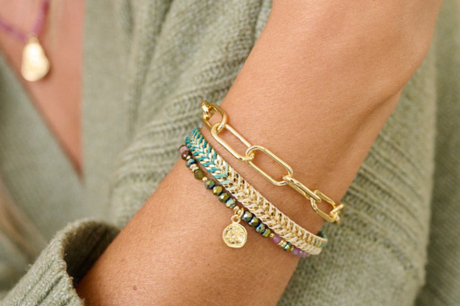 Pamban Gold & Tourmaline Stacking Bracelets styled on the wrist, featuring vibrant tourmaline beads and gold accents. Ideal for layering or gifting.