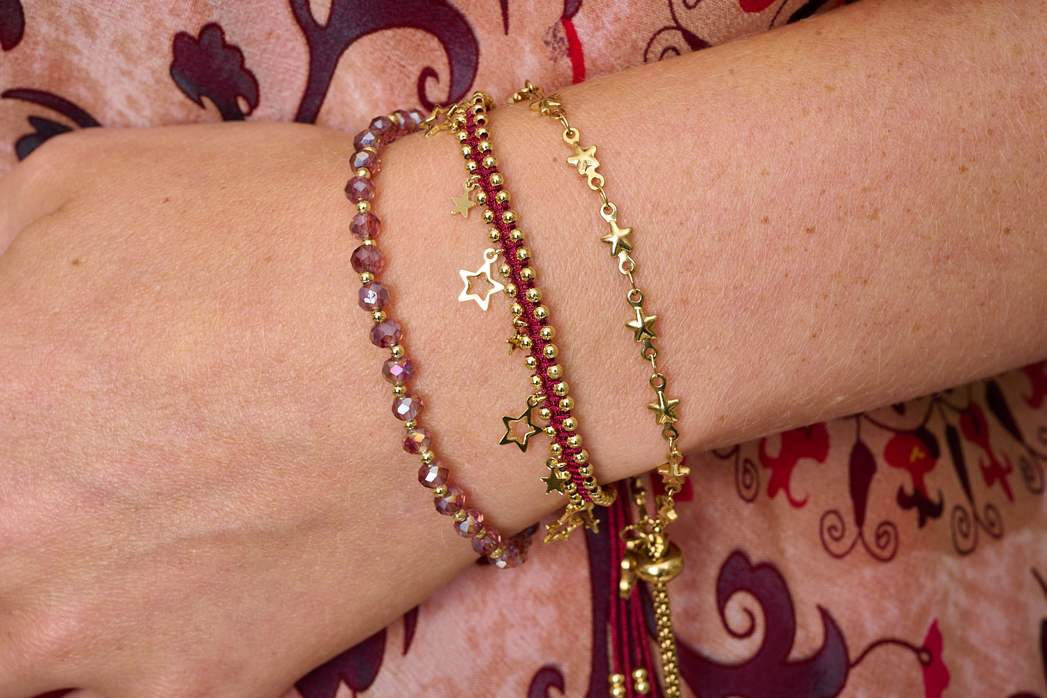 Pomona Red & Gold Bracelet Stack, star chain, crimson braid and pink crystal strand layered together.