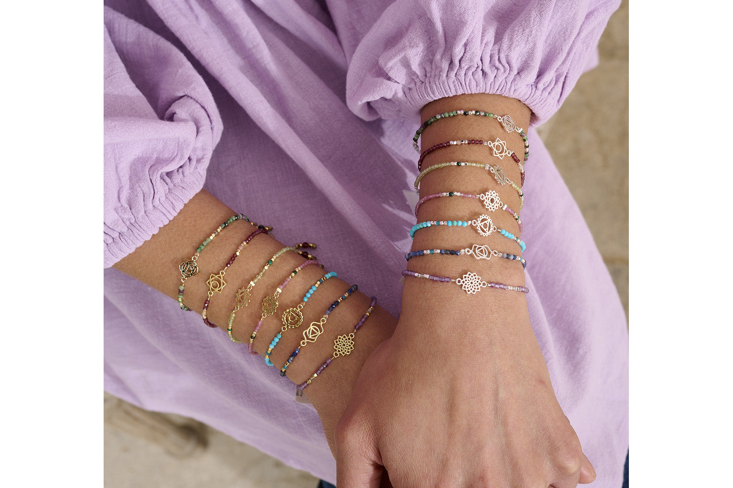 Ruby Zoisite & Silver Root Chakra Bracelet styled on the wrist, showcasing its bold gemstone hues, silver accents, and meaningful chakra charm.
