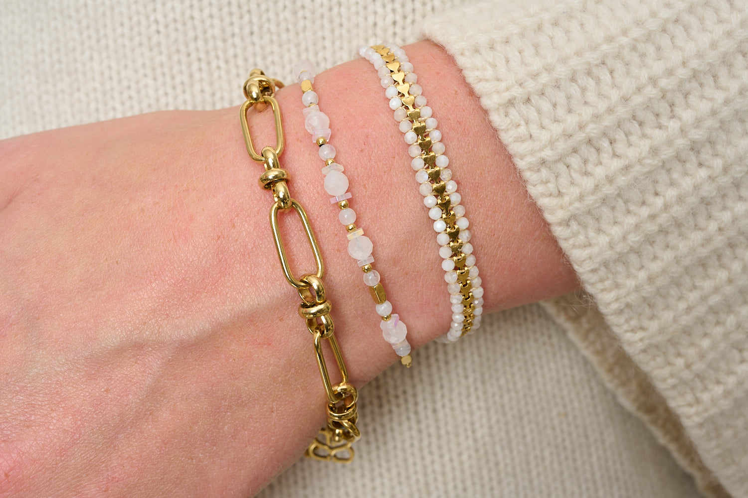 Safra Rainbow Moonstone & Gold Bracelet Stack styled on wrist with Boho Betty layered gold and gemstone bracelets