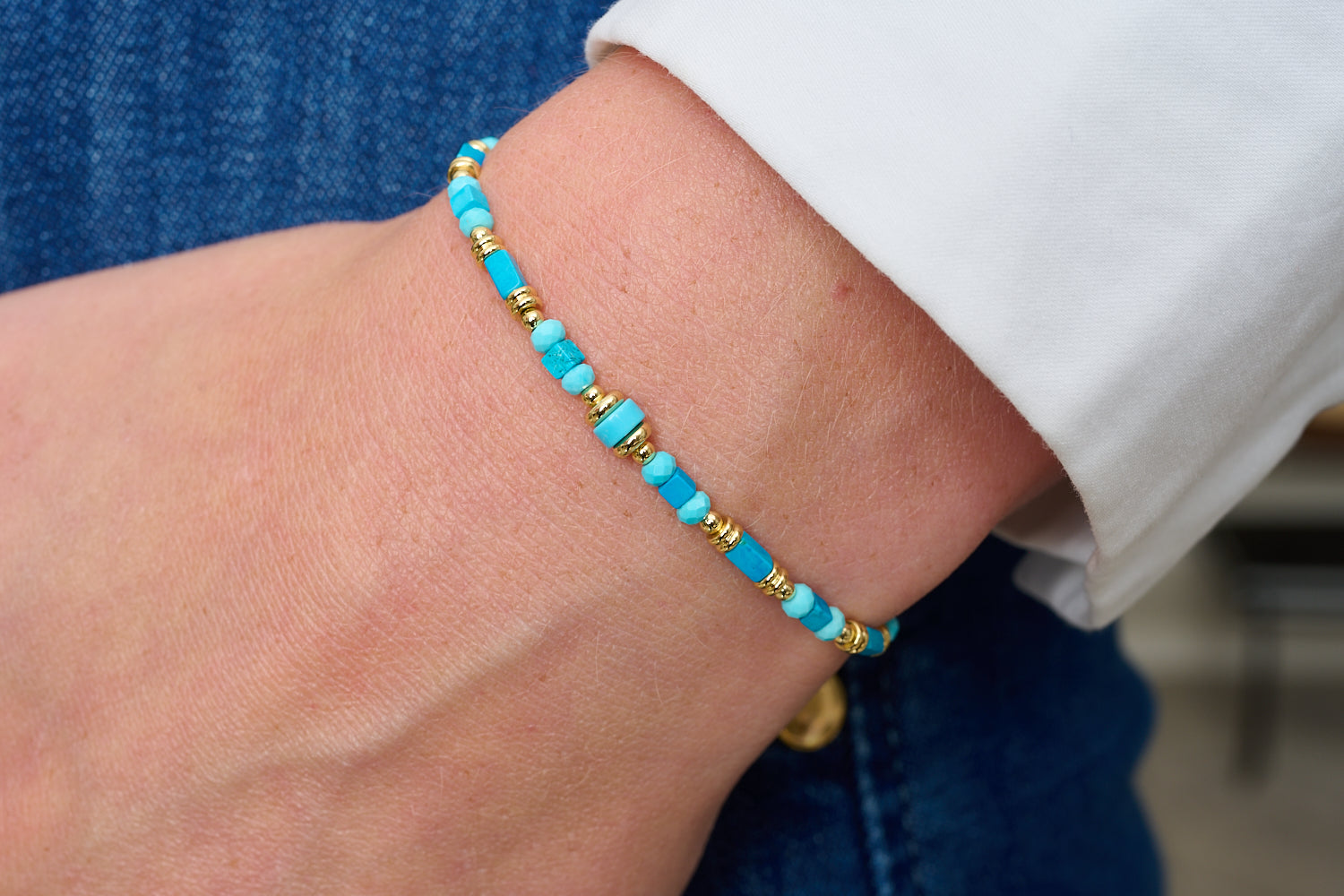 Salma Turquoise Howlite & Gold Friendship Bracelet featured on wrist with Boho Betty stacking bracelets in turquoise and gold tones.