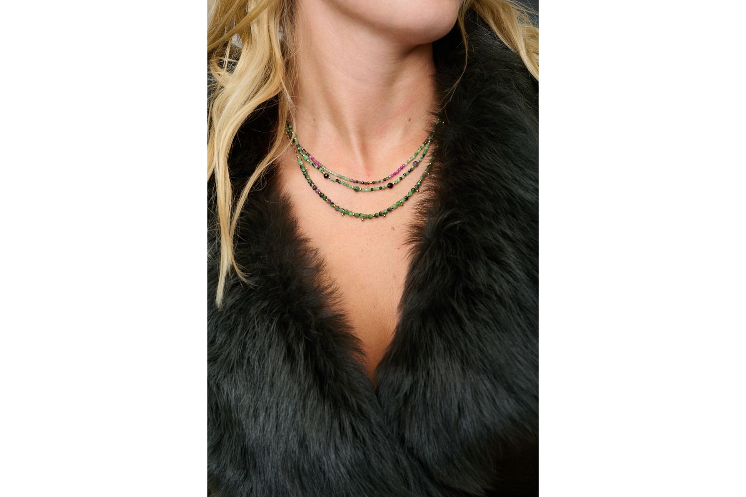 Salus Ruby Zoisite Necklace styled with layered gold necklaces and vibrant boho accessories for a colourful summer jewellery look.