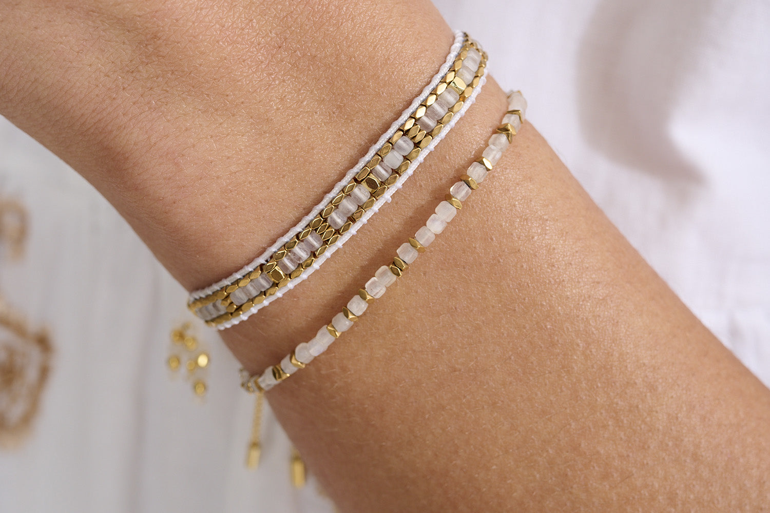 Seraphina White & Gold Bead Bracelet styled for boho-chic stacking, with glowing white beads and gold accents—perfect for layering or wearing solo for a radiant, everyday look.