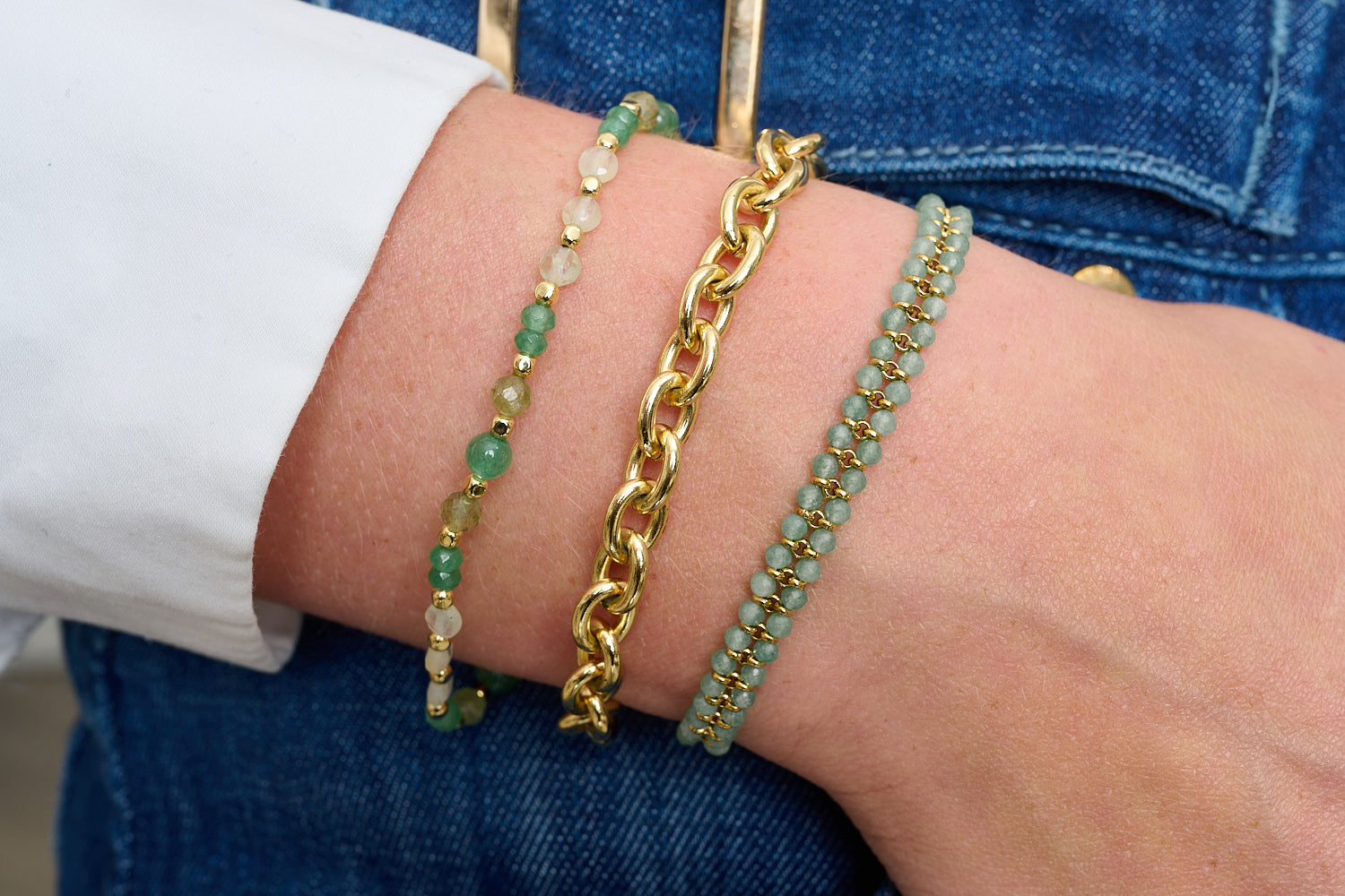Talia Green Aventurine & Gold Gemstone Bracelet styled on wrist, showcasing layered green gemstone beads and radiant gold-plated accents for a boho-inspired look.