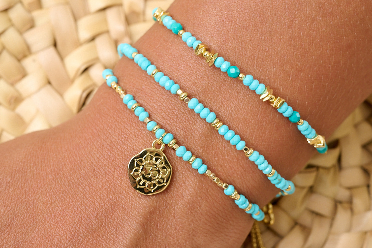Tortola Turquoise Howlite & Gold Bracelet Stack styled on wrist with layered Boho Betty coastal gold and turquoise bracelets