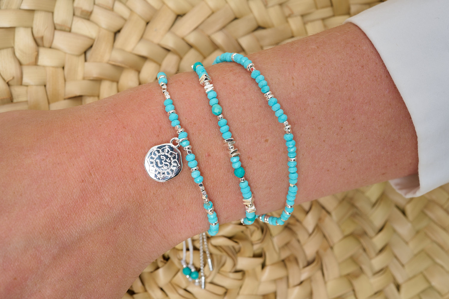Tortola Turquoise Howlite & Silver Bracelet Stack styled on wrist with layered Boho Betty coastal silver and turquoise bracelets