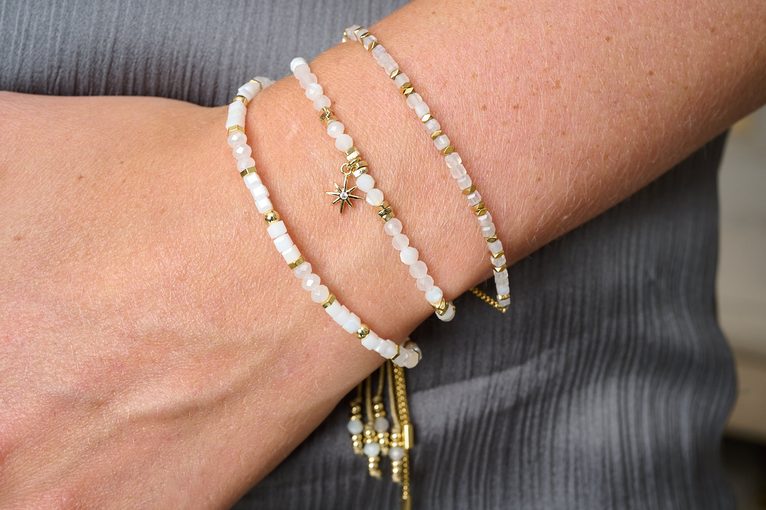 Una Gold & Rainbow Moonstone Mix Gemstone Bracelet featured on wrist with Boho Betty stacking bracelets