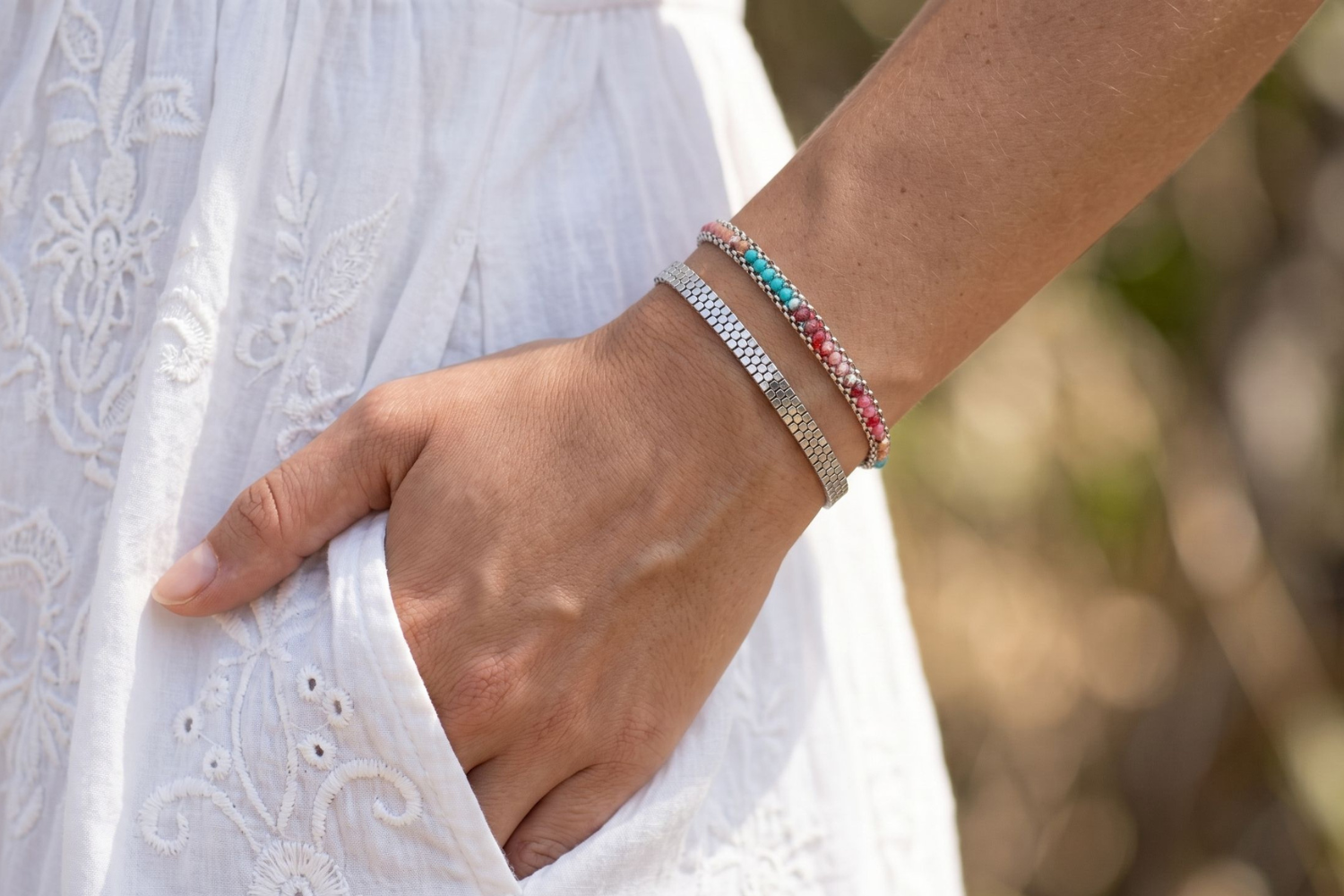 Vaadhoo Candy and Silver Bracelet Stack styled on the wrist, showcasing colourful woven gemstone detailing and polished silver bracelets for relaxed everyday styling.
